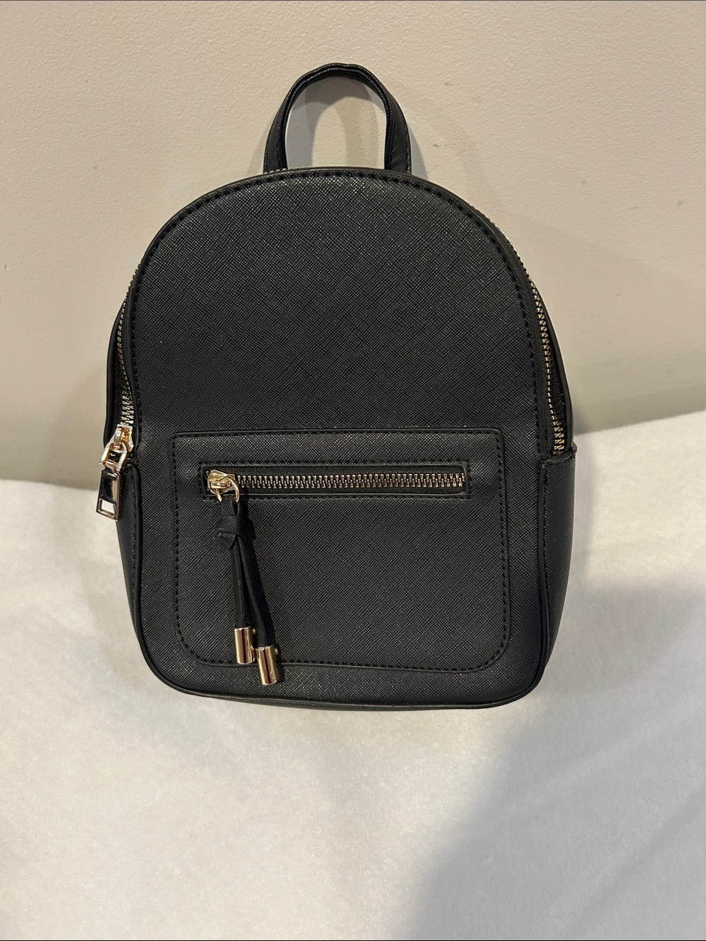Compact Black Mini Backpack with Gold Accents